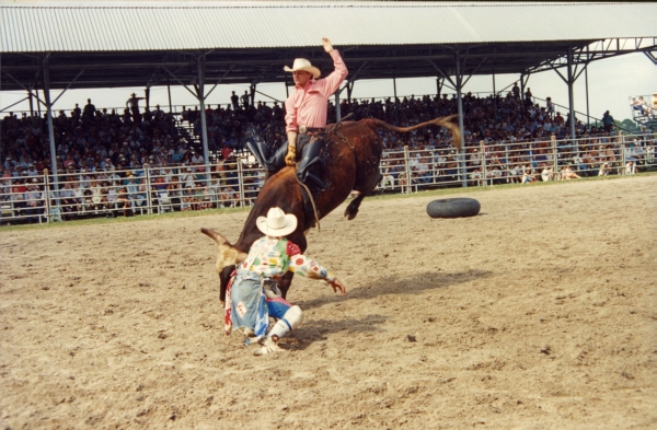 Bull riding at Cattlemen's Arena during rodeo in Okeechobee.