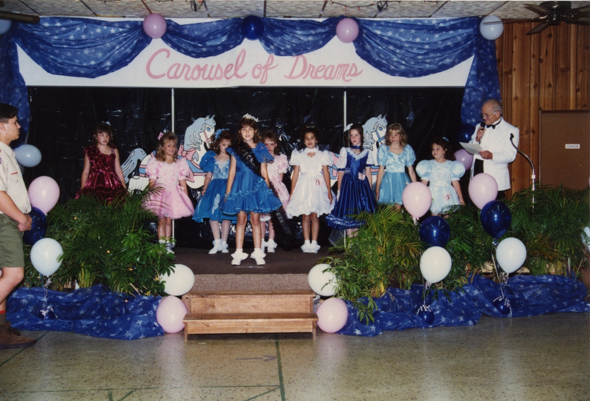 1995 Speckled Perch Princess on stage with the 1996 contestants.