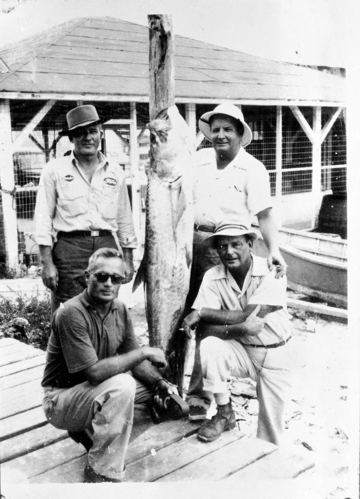 Four Madison County men with a tarpon