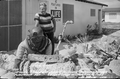 Postcard of treasure hunter Art McKee standing in front of his museum - Plantation Key, Florida