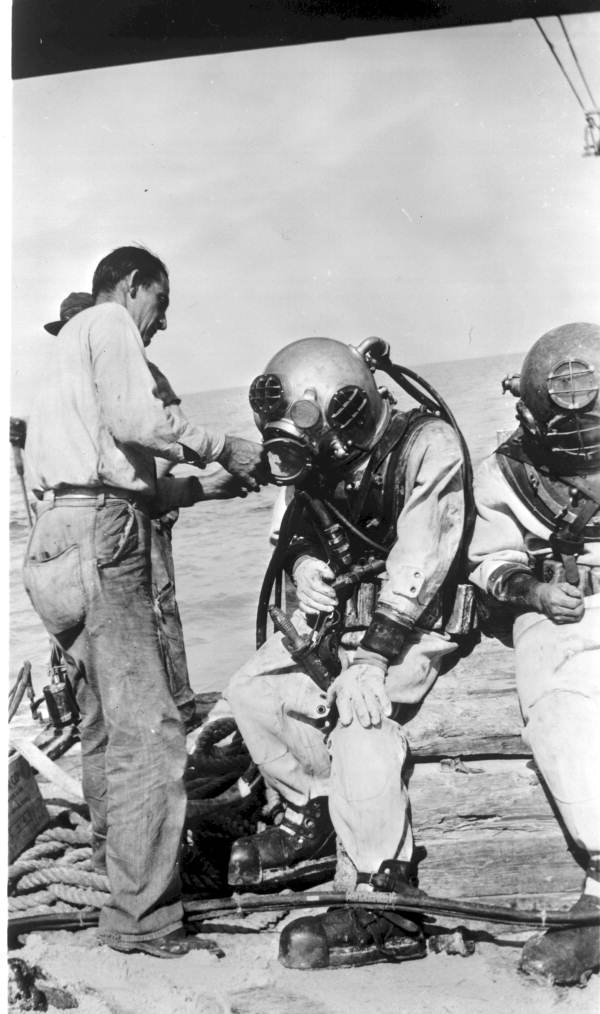 Diver being suited.