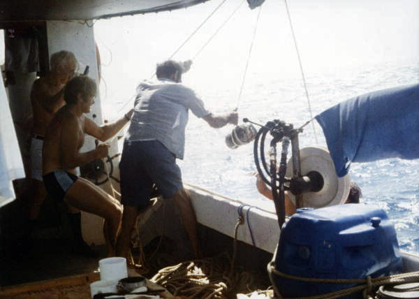 Hoisting the 80 lb. silver bar aboard Polaris.
