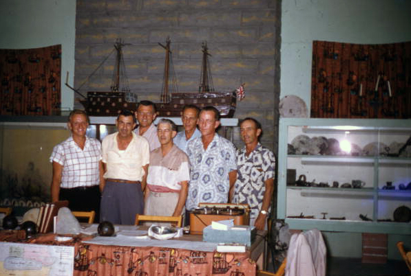 Treasure hunter Art McKee assembled with men for group portrait - Plantation Key, Florida