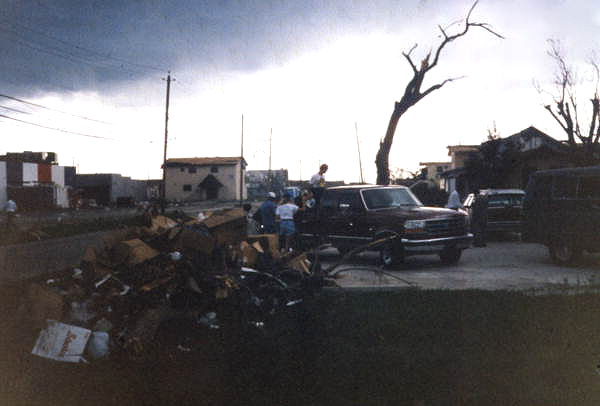 View showing debris piled up following Hurricane Andrew - Dade County, Florida.