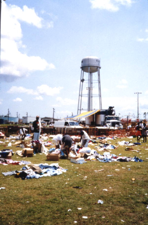 Victims looking through boxes of aid following Hurricane Andrew in Dade County, Florida.