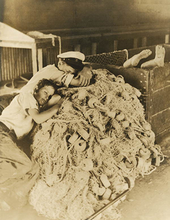 Boys sleep in the fish house on the idle nets: Riviera Beach, Florida (1939)
