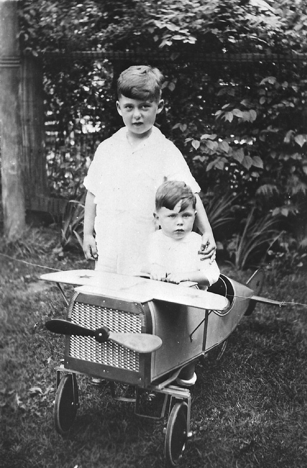 Arthur and Jack Courshon with a toy airplane