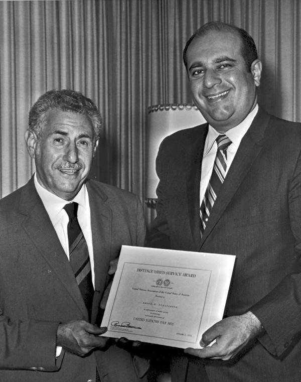 Andre Bialolenki being presented the Distinguished Service Award.