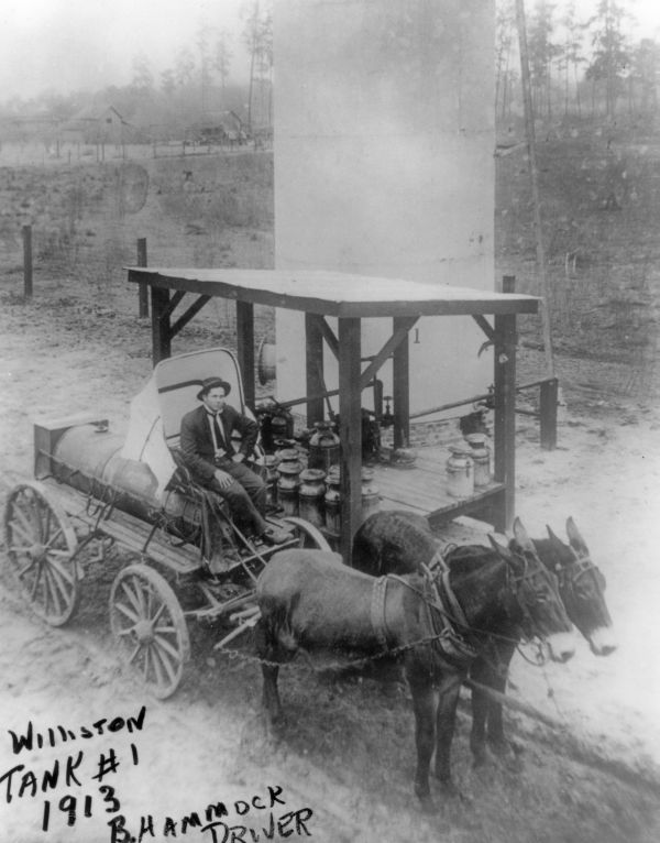 Mr. B. Hammock on tank wagon at Williston Bulk Plant - Williston, Florida