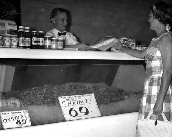 Women buying seafood