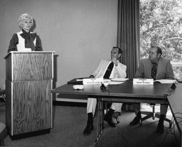Florida Dept. of Natural Resources director Harmon Shields with Florida Park Service director Ney Landrum listening to unidentified speaker - Tallahassee, Florida