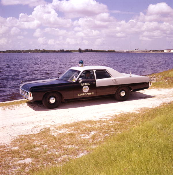 Florida Marine Patrol officer in his vehicle