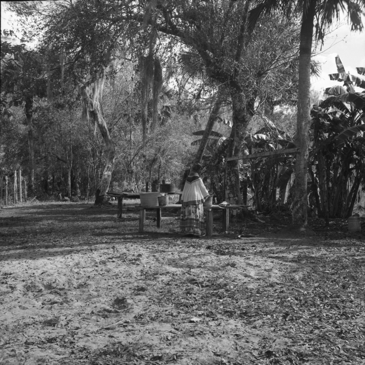 Seminole woman washing clothes by hand