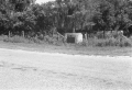 Battle of Okeechobee stone marker with plaque by the side of the road.