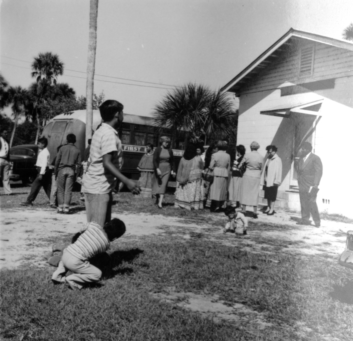 Seminole Indians standing in front of the Indian Baptist Church
