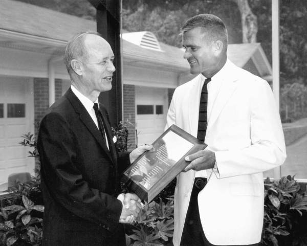 Florida Governor Farris Bryant holding a plaque.