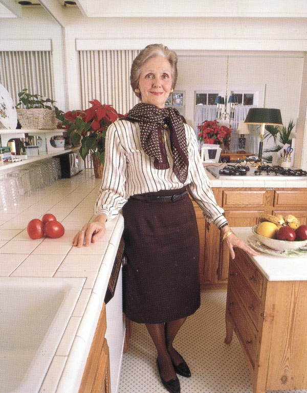 Lawton Chiles' wife Rhea standing in a kitchen.