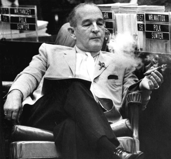 Representative E.C. Rowell smoking a ciger.