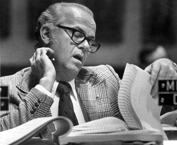 Ted Banell examining a portion of the appropiations bill.