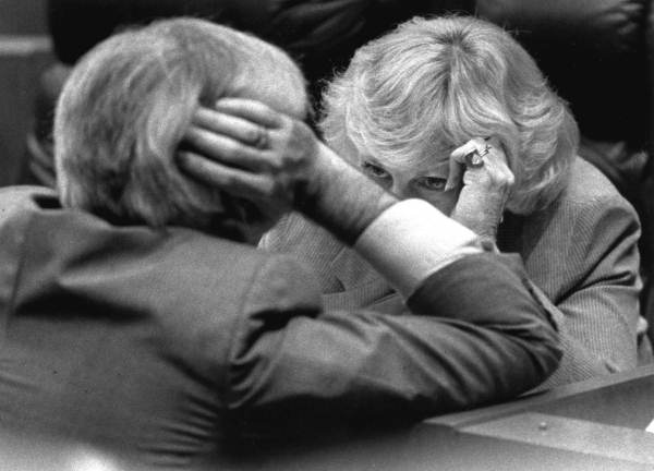 Representatives conferring.