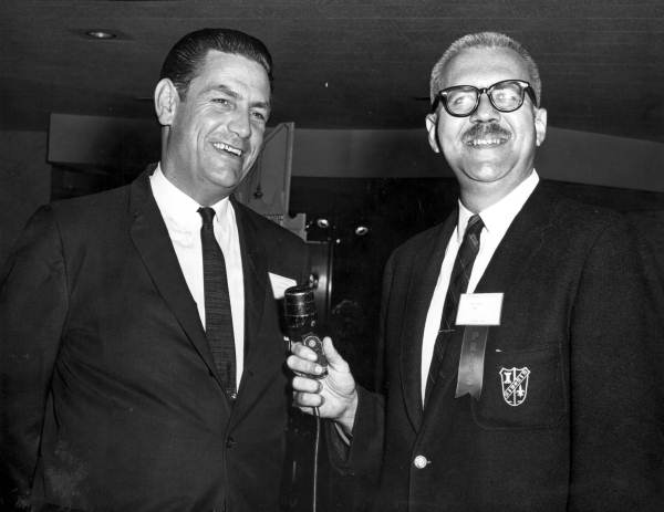 Newsman Ray Star interviewing a governor at a governors' conference