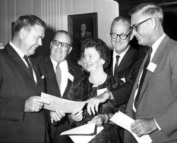 Smiling people involved in the political process.