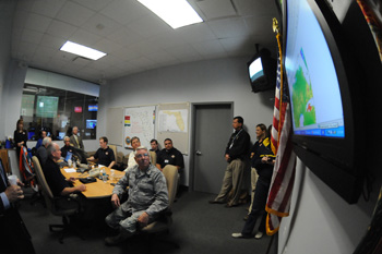 View showing Governor Charlie Crist meeting with Division of Emergency Management personnel during Tropical Storm Fay.