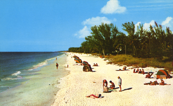 Visitors at a beach in Naples.