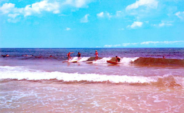 Surfing is just one of many water sports enjoyed by visitors to Panama City and her beaches :.