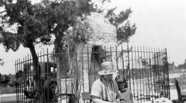 Woman and child sitting by the Old Spanish Chimney on Anastasia Island in Saint Johns County near Saint Augustine, Florida.