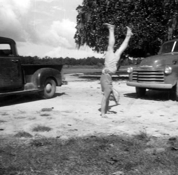J.W. Jones doing a handstand near Bell, Florida.