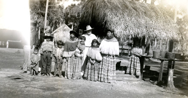 Portrait of Hazel and Doc Engelbert with Seminoles at a Seminole Indian Village in Florida.
