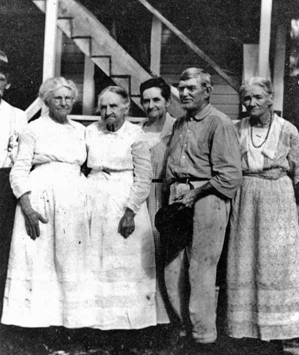 Five family members in the rear of the English home