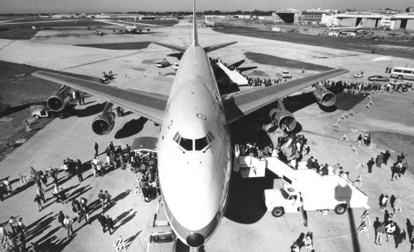 Aerial view of passengers boarding an airplane