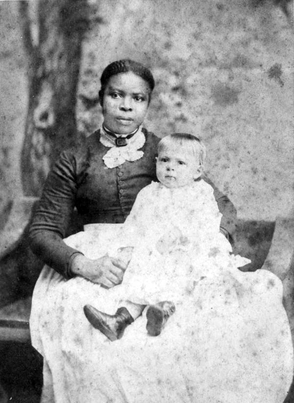 Former slave "Aunt Jane" with one of the J. D. Palmer children