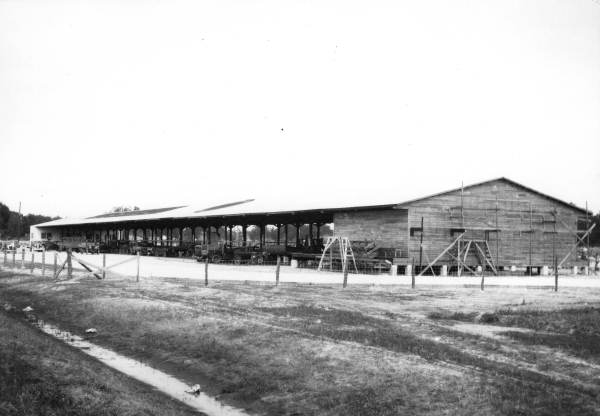 Open-air building and trucks