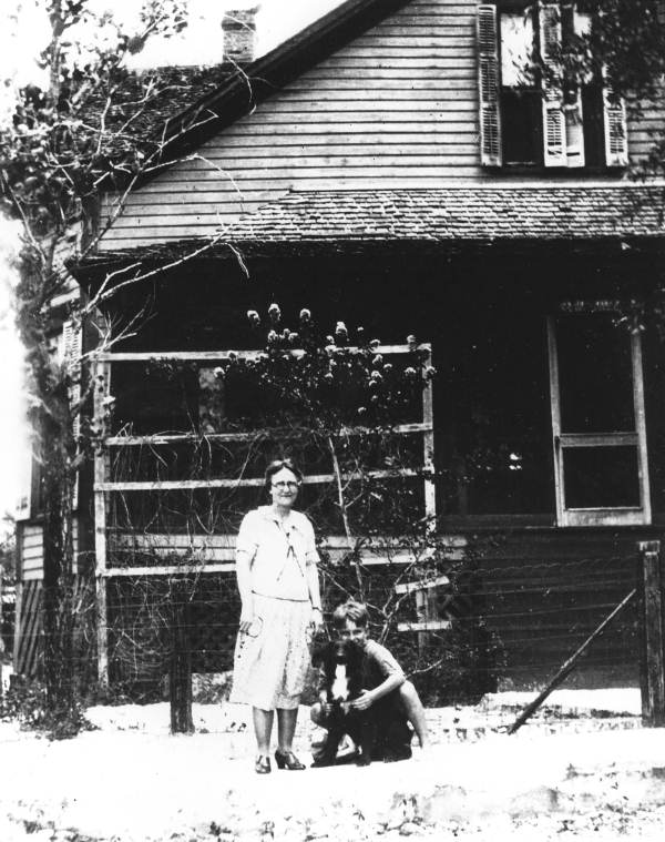 Cecilia and Max Kilbourn in front of Kilbourn home