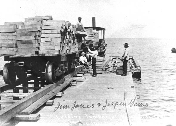 Jim Jones and Jasper Gaines loading lumber at Hammond's landing
