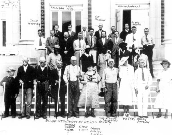Lion's Club members pose with a group of blind persons with new white canes - De Soto County, Florida