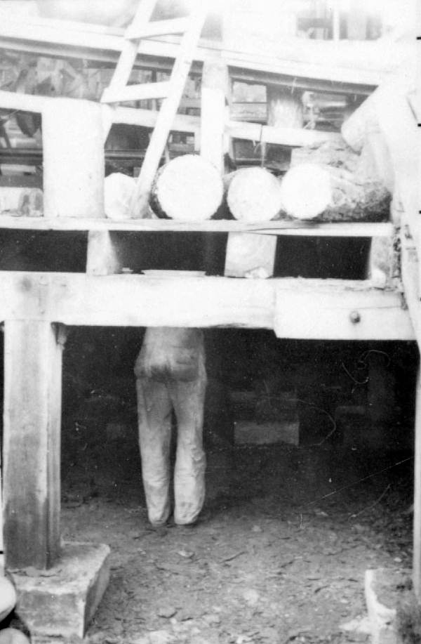 Man working under bridge or deck