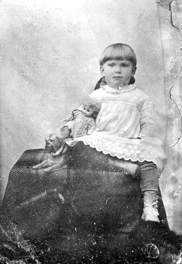 Child with doll and dog..