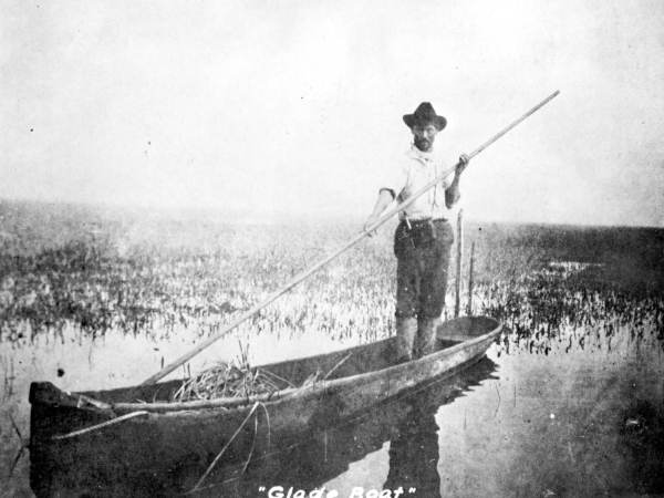 Man guiding boat in the Everglades