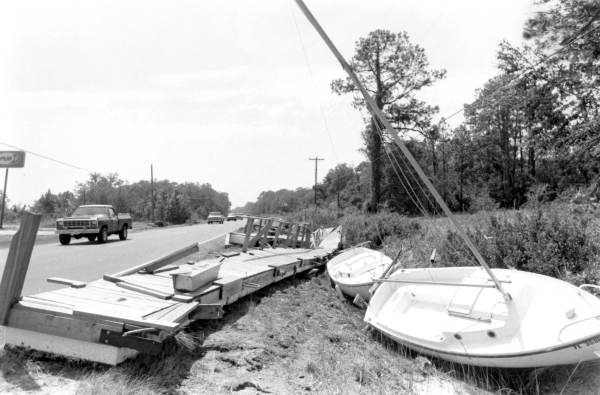 Boats and section of dock washed ashore by Hurricane Elena