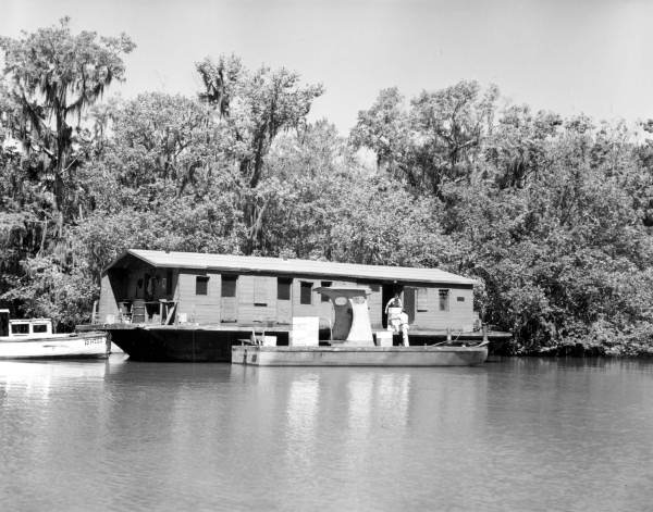 Loading honey on a boat.