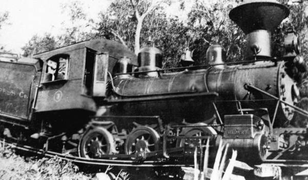 Union Cypress Company engine #3 up to her saddle in a trestle