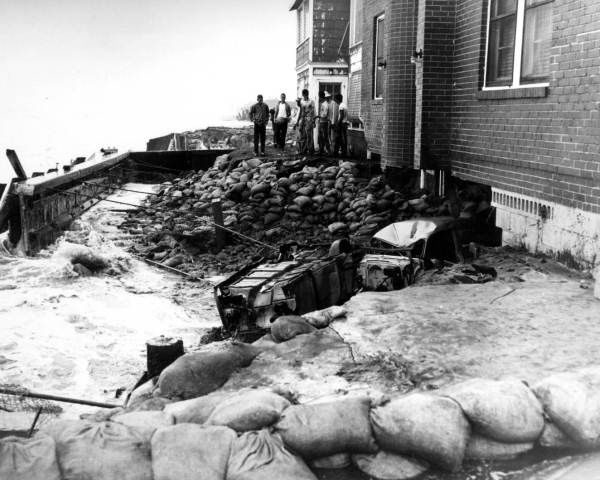 Collapsed sea-wall and home.
