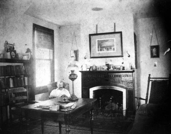 W.E. Parmenter, Jr. in his home