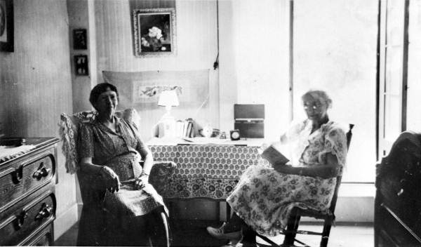 Women in the bedroom of the Breen home - Pensacola, Florida.