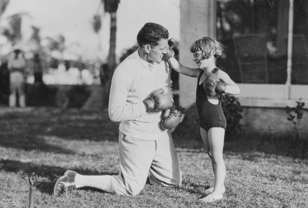 Gene Tunney getting socked by Jackie Ott the Aqua Tot.