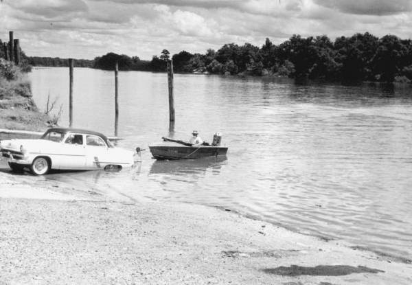 Car towing boat from the Apalachicola River.